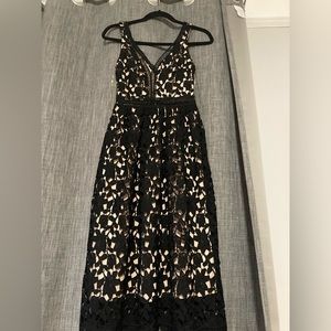 Like new Gianni Bini black midi floral lace dress with nude underlining. Size XS